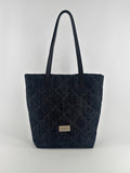 Quilted denim tote bag on a white background
